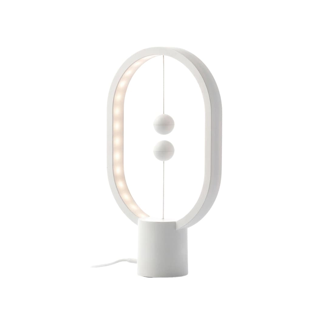 Lámpara de equilibrio con interruptor magnético y luz LED cálida en mesa de noche