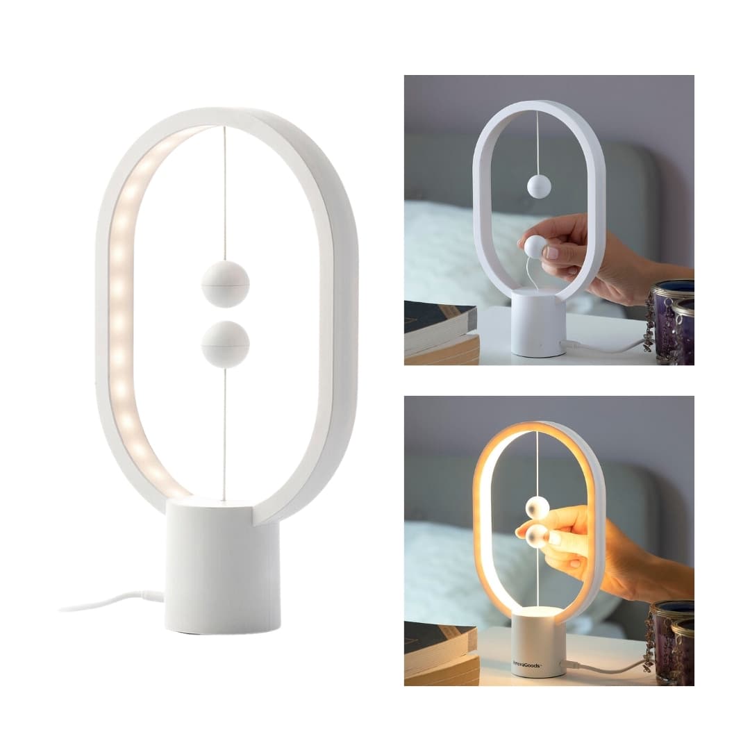 Vista lateral de lámpara de equilibrio con diseño elíptico y luz LED cálida encendida