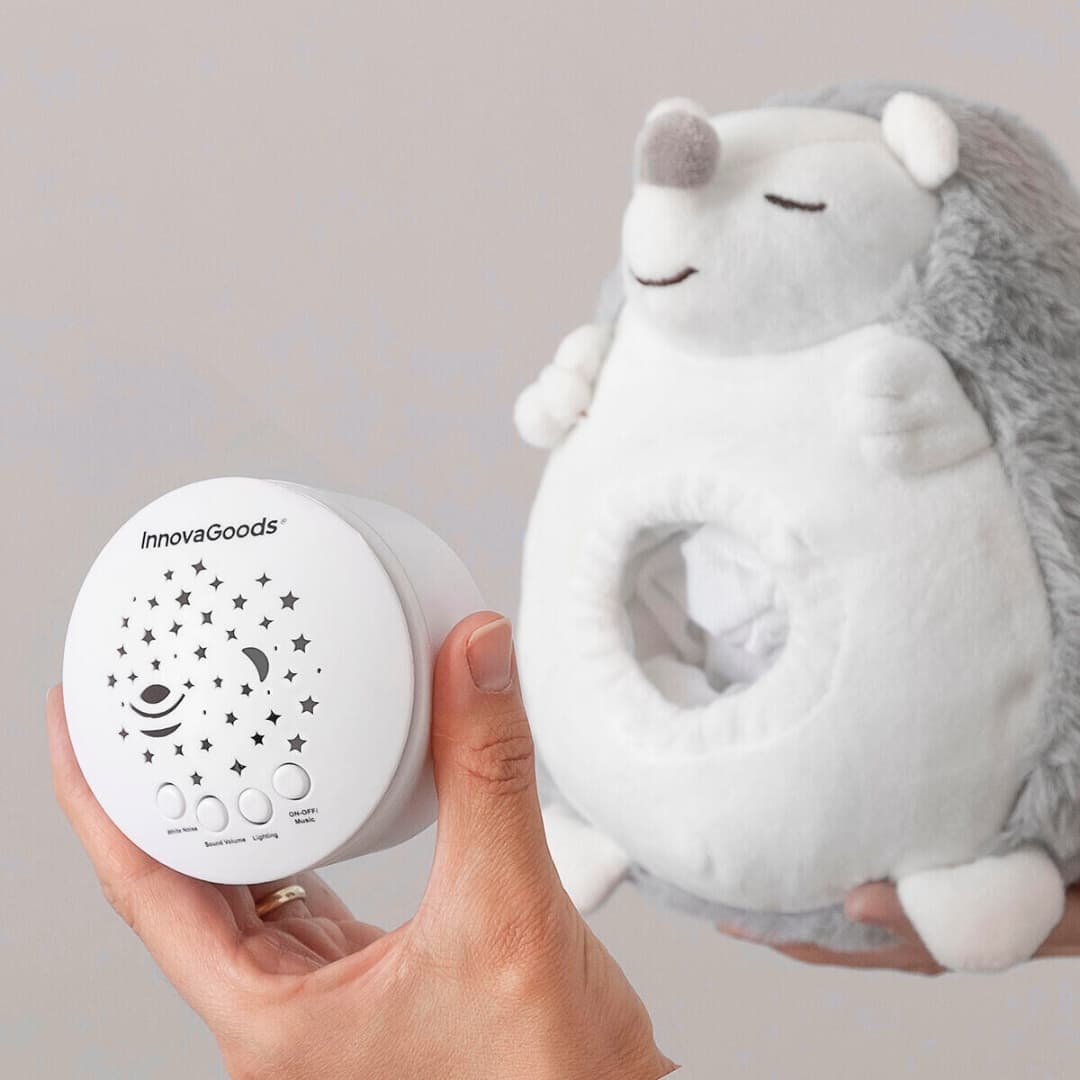 Peluche con proyector de estrellas y melodías calmantes para bebés