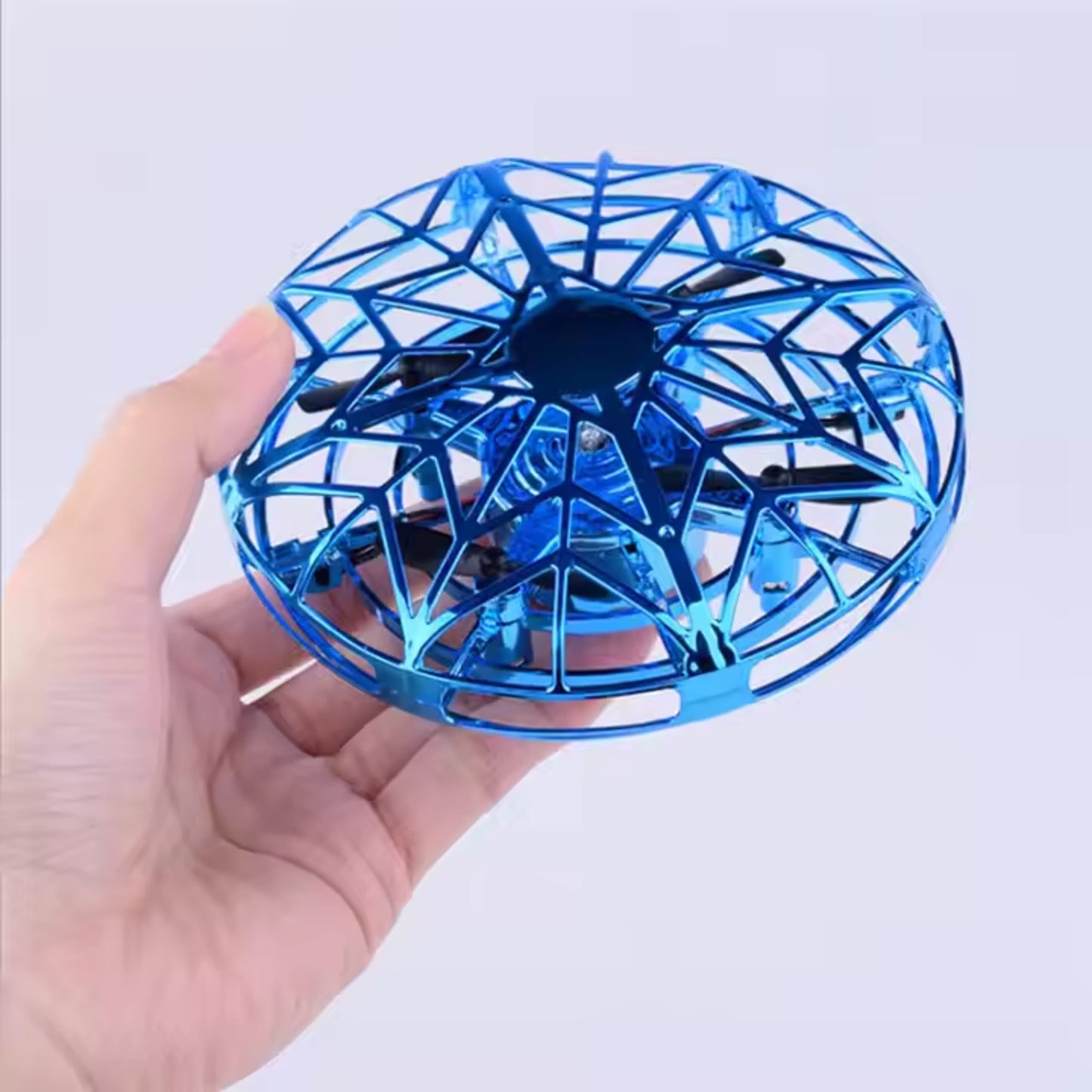 Dron encendido con luces LED multicolor brillando mientras vuela.