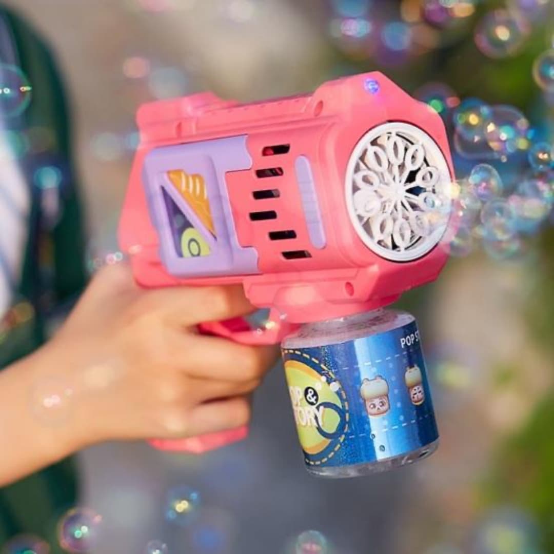 Accesorios del set rosa: botella de líquido, bandeja y pistola.