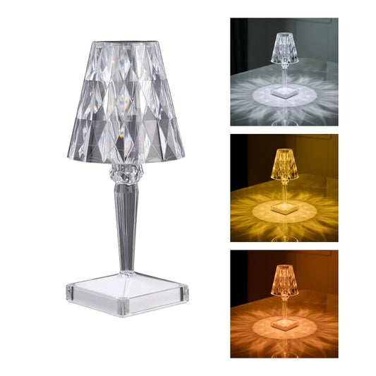 Lámpara LED con forma de diamante de cristal encendida, emitiendo luces RGB de colores cambiantes.