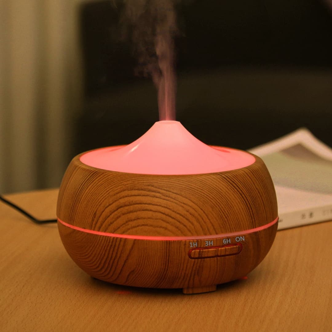 Vista lateral del humidificador LED con diseño compacto y elegante en color blanco