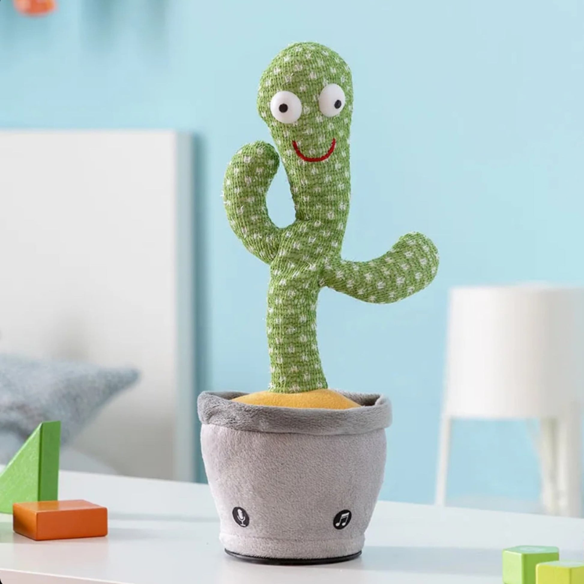 Vista completa del cactus en maceta bailando con música y luces
