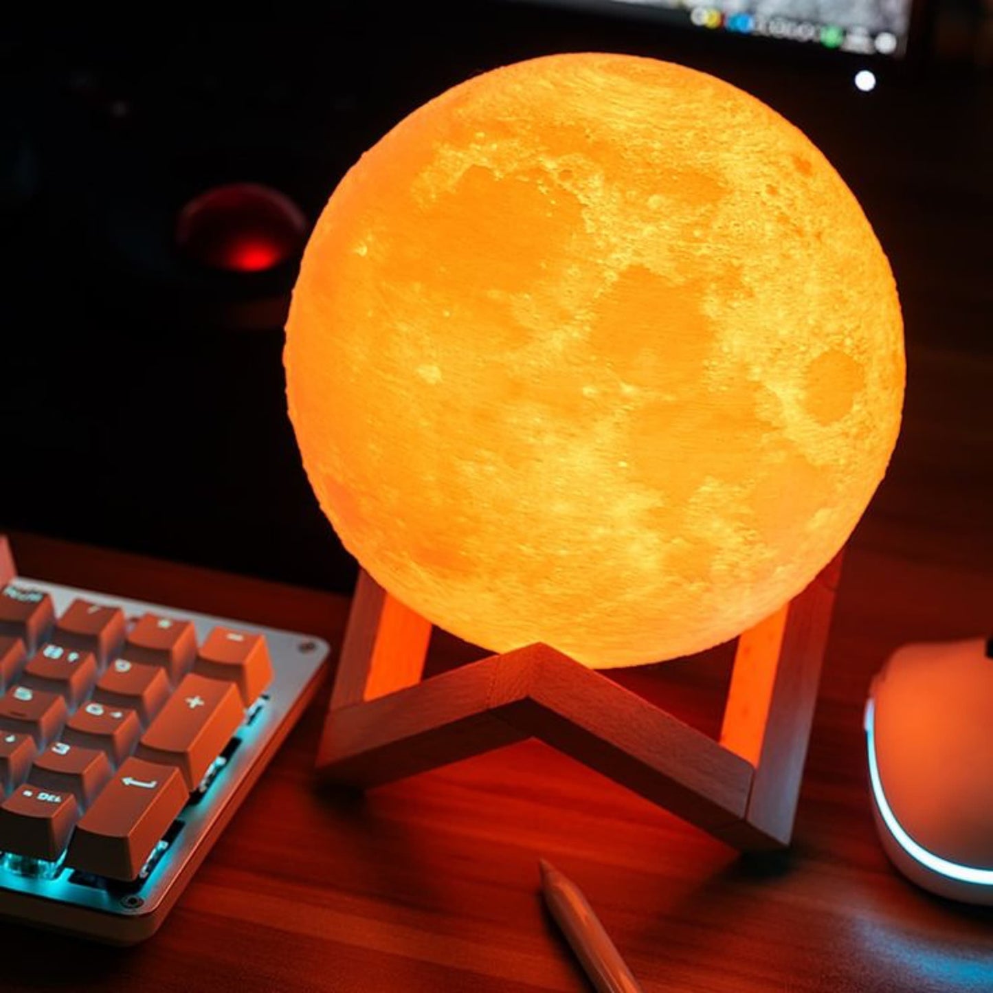 Lámpara luna con base, control y cable USB dentro del empaque de venta.