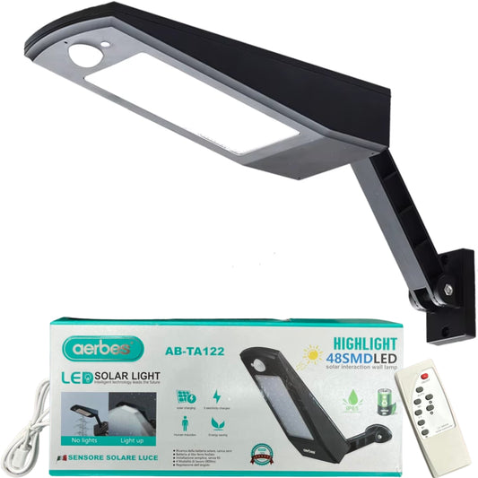 Farola solar LED negra con sensor de movimiento, incluye control remoto, cable USB y caja original. Ideal para iluminación exterior sin instalación eléctrica.