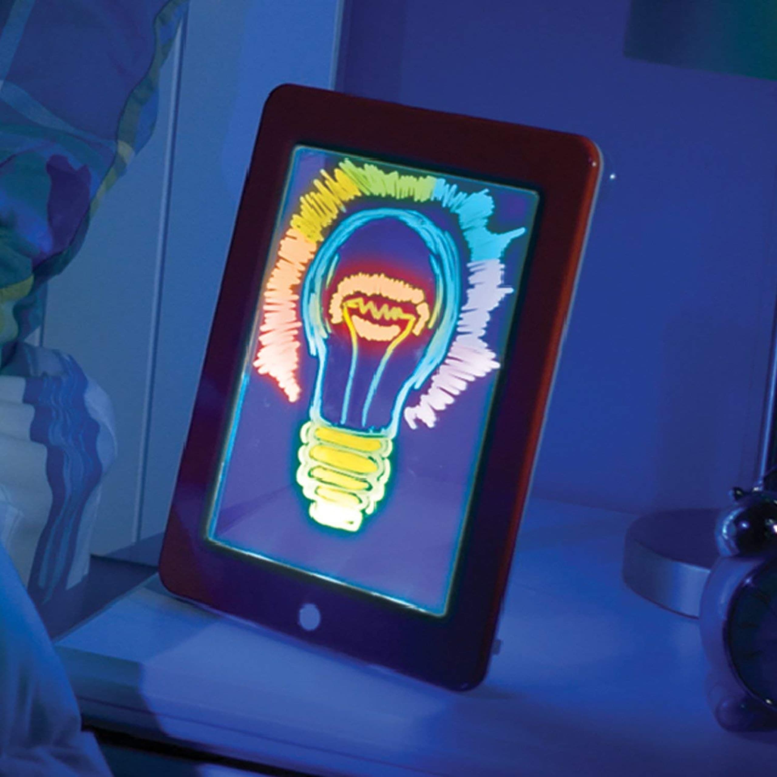 Tableta MagicPad encendida con un dibujo colorido en luces neón brillantes
