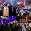 Personas disfrutando en un evento nocturno usando palos de espuma LED Mega Espuma 50 encendidos en varios colores