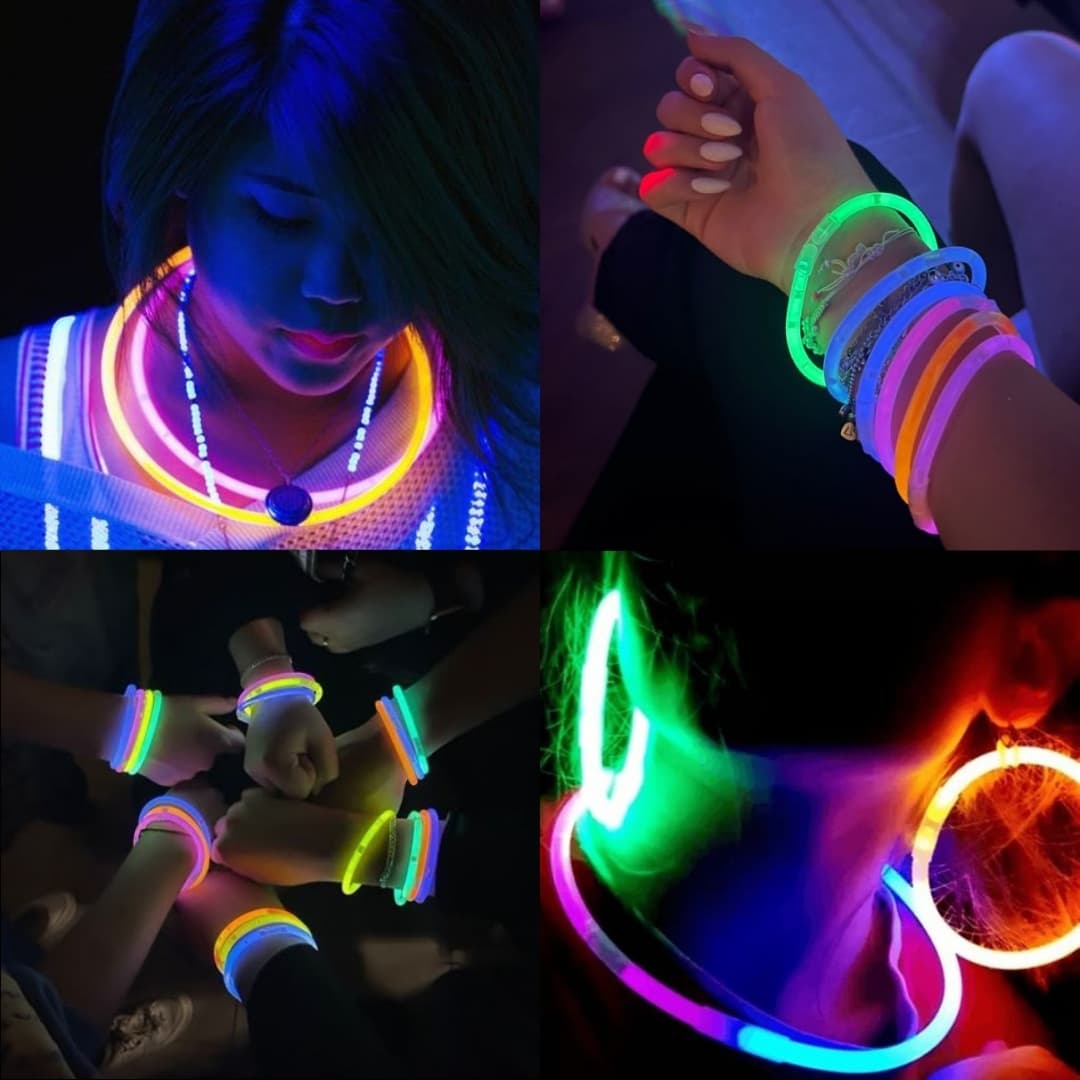 Personas usando pulseras luminosas GlowMaster Pro en evento Personas disfrutando en un evento nocturno con pulseras luminosas GlowMaster Pro encendidas en diferentes colores