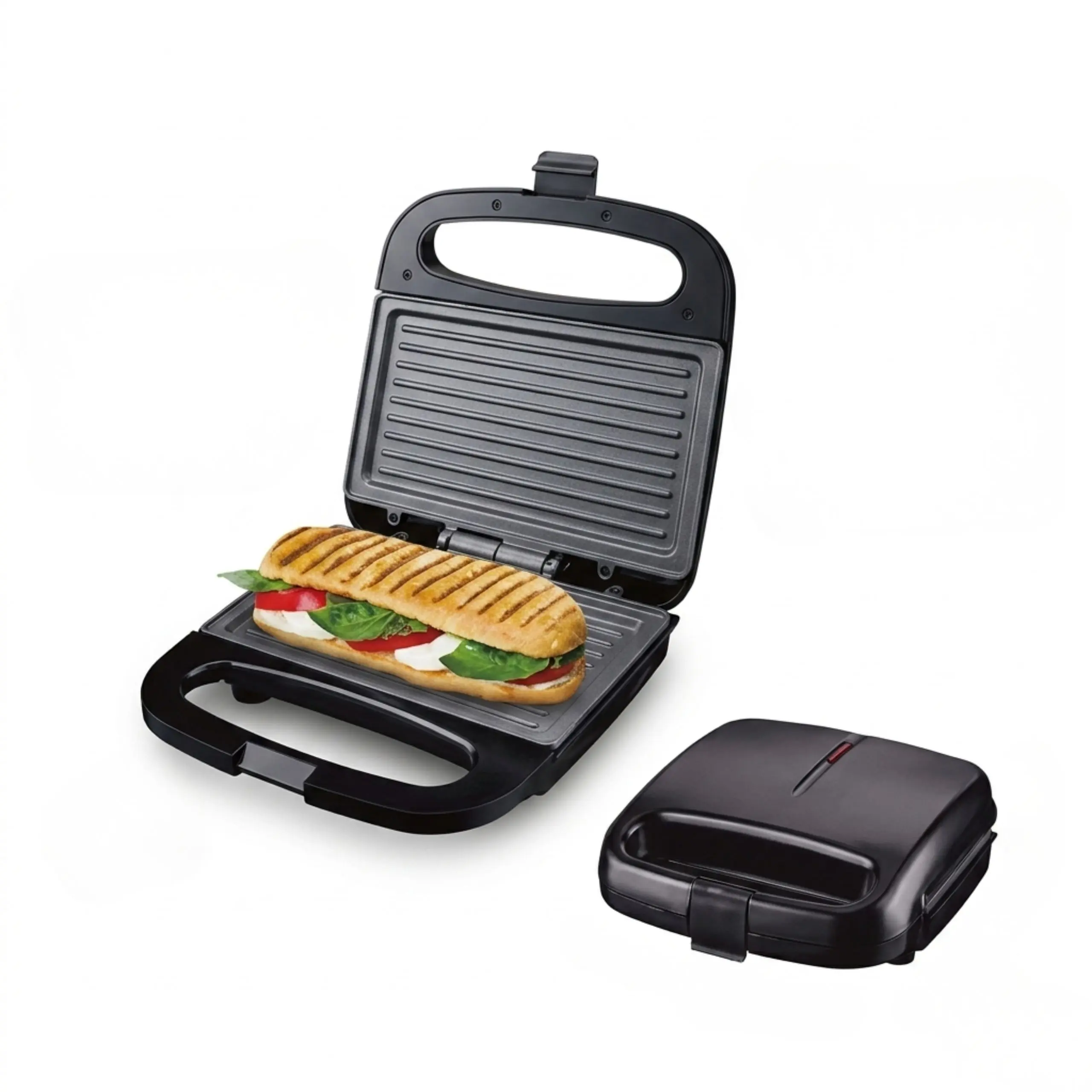 Prensadora de Paninis Profesional con Cierre de Seguridad Prensadora de panini profesional de color negro con placas de grill abiertas y cerradas sobre fondo blanco.